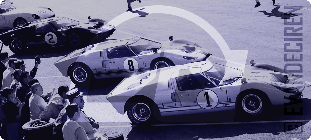Five iconic Ford GT40 race cars lined up at Le Mans, symbolizing the spirit of classic motorsport — illustration for the article “5 Must-Watch Racing Movies”.