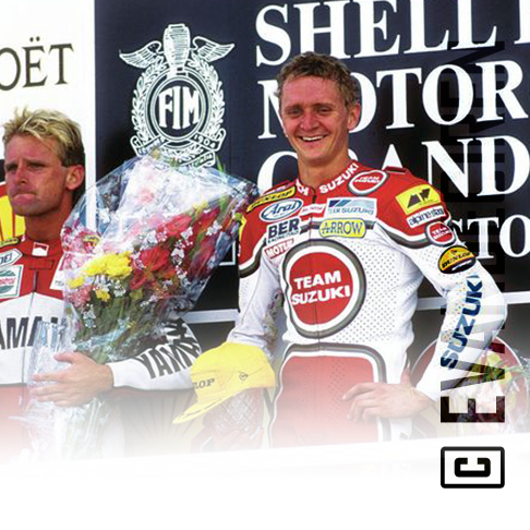 Kevin Schwantz celebrating victory for Team Suzuki during the 500cc Grand Prix — the spirit of the Golden Era of 500cc.