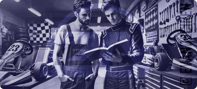 Advice: 5 Manuals of Karting – Two mechanics studying a kart manual inside a workshop, surrounded by racing karts and tools.